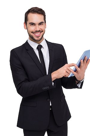 simsearch:400-06795988,k - Businessman using his tablet while looking at the camera on white background Foto de stock - Super Valor sin royalties y Suscripción, Código: 400-07927326