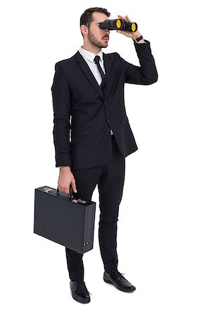Businessman holding a briefcase while using binoculars on white background Stock Photo - Budget Royalty-Free & Subscription, Code: 400-07927328