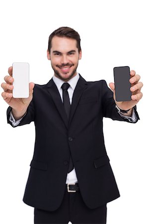 simsearch:400-07664375,k - Smiling businessman showing mobile in each hand on white background Foto de stock - Royalty-Free Super Valor e Assinatura, Número: 400-07927321