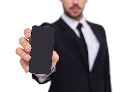 simsearch:400-07139155,k - Businessman showing smartphone to camera on white background Stock Photo - Budget Royalty-Free & Subscription, Code: 400-07927322