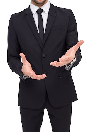 simsearch:400-04861869,k - Mid section of a businessman showing with his hands on white background Foto de stock - Royalty-Free Super Valor e Assinatura, Número: 400-07927337