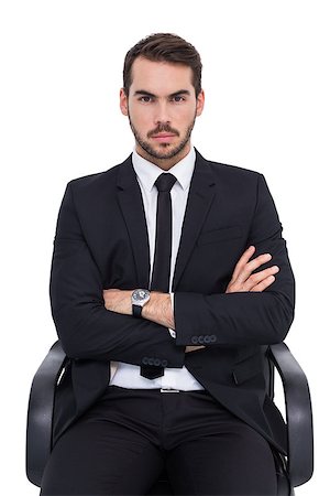 simsearch:400-07274414,k - Serious businessman sitting with arms crossed on white background Photographie de stock - Aubaine LD & Abonnement, Code: 400-07927384