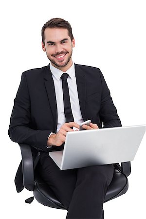 simsearch:400-07141019,k - Happy businessman with laptop using smartphone on white background Stockbilder - Microstock & Abonnement, Bildnummer: 400-07927387