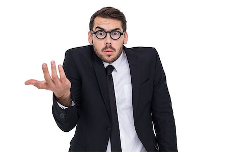 simsearch:400-04861869,k - Doubtful businessman with glasses gesturing on white background Foto de stock - Royalty-Free Super Valor e Assinatura, Número: 400-07927380
