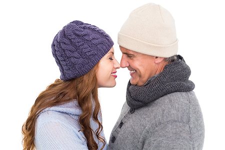 Couple in warm clothing facing each other on white background Stockbilder - Microstock & Abonnement, Bildnummer: 400-07927781