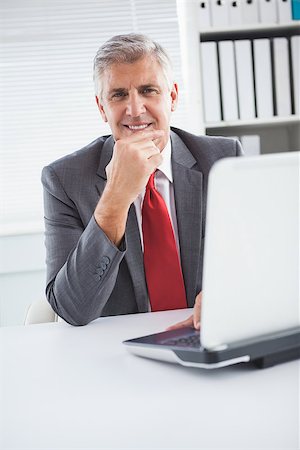 simsearch:400-07927898,k - Happy businessman at his desk in his office Stock Photo - Budget Royalty-Free & Subscription, Code: 400-07927886
