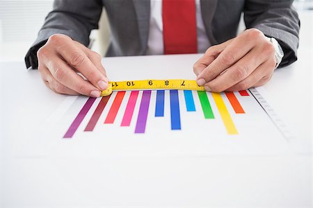 simsearch:400-07927898,k - Businessman measuring graph with tape in his office Stock Photo - Budget Royalty-Free & Subscription, Code: 400-07927890