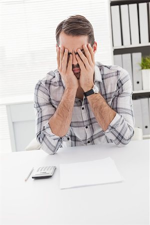 simsearch:400-07931035,k - Casual businessman feeling stressed at his desk in his office Stock Photo - Budget Royalty-Free & Subscription, Code: 400-07927971