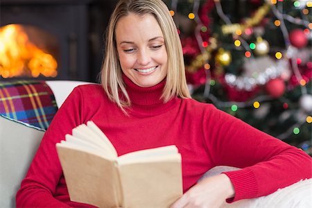 simsearch:6109-06194272,k - Pretty blonde reading book at christmas time at home in the living room Stock Photo - Budget Royalty-Free & Subscription, Code: 400-07928084