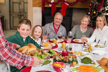 simsearch:400-06871551,k - Man serving roast turkey at christmas at home in the living room Stock Photo - Budget Royalty-Free & Subscription, Code: 400-07928259