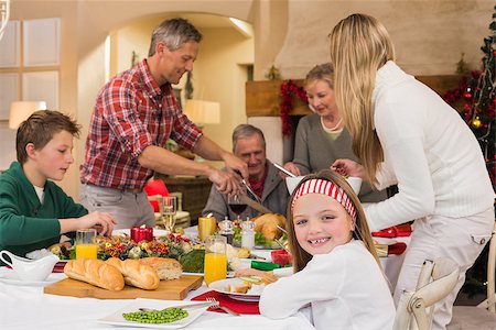 simsearch:400-07928327,k - Three generation family having christmas dinner together at home in the living room Foto de stock - Super Valor sin royalties y Suscripción, Código: 400-07928274