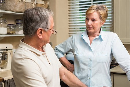 simsearch:400-05089878,k - Senior couple having an argument at home in the kitchen Stock Photo - Budget Royalty-Free & Subscription, Code: 400-07928424