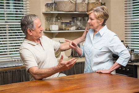 simsearch:400-05089878,k - Senior couple having an argument at home in the kitchen Stock Photo - Budget Royalty-Free & Subscription, Code: 400-07928425