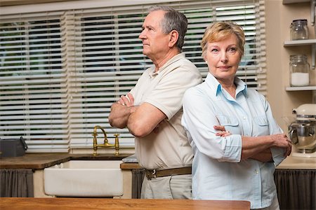 simsearch:400-05089878,k - Senior couple having an argument at home in the kitchen Stock Photo - Budget Royalty-Free & Subscription, Code: 400-07928427