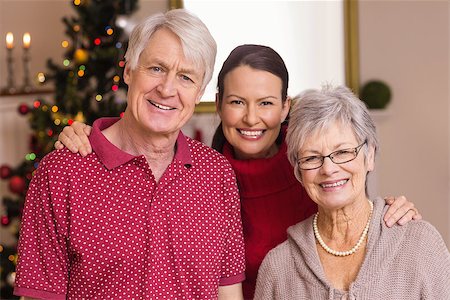 simsearch:400-07928326,k - Portrait of a happy family at christmas at home in the living room Photographie de stock - Aubaine LD & Abonnement, Code: 400-07928865