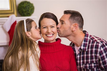 simsearch:400-07931092,k - Daughter with her father kissing her mother at home in the living room Foto de stock - Super Valor sin royalties y Suscripción, Código: 400-07928896