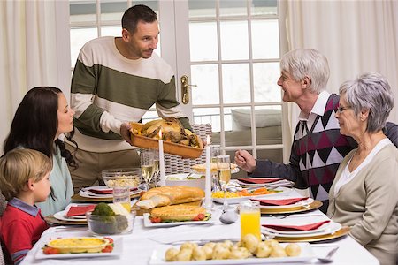 Man serving and showing roast turkey at christmas at home in the living room Stock Photo - Budget Royalty-Free & Subscription, Code: 400-07928907