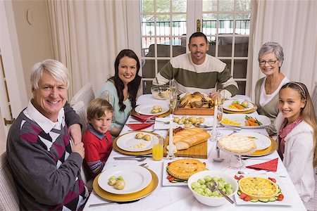 simsearch:400-07929054,k - Extended family looking at camera at christmas time at home in the living room Stock Photo - Budget Royalty-Free & Subscription, Code: 400-07928937