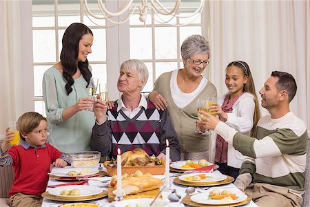 simsearch:400-07929054,k - Family toasting with champagne in a christmas dinner at home in the living room Stock Photo - Budget Royalty-Free & Subscription, Code: 400-07928959