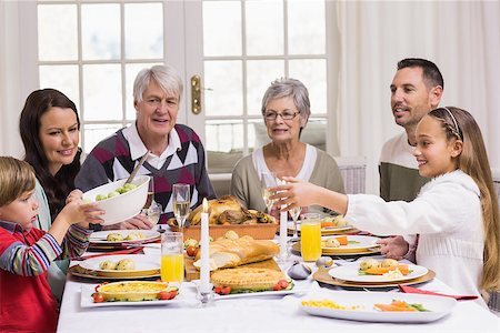 simsearch:400-07929054,k - Smiling extended family at the christmas dinner table at home in the living room Stock Photo - Budget Royalty-Free & Subscription, Code: 400-07928965