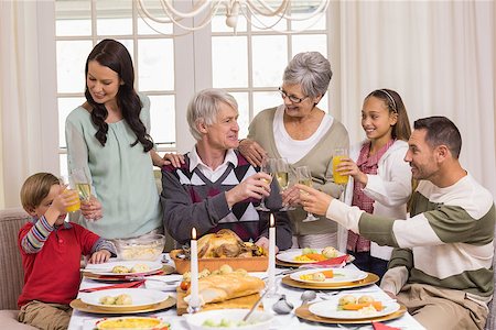 simsearch:400-07928327,k - Family toasting with champagne in a christmas dinner at home in the living room Foto de stock - Super Valor sin royalties y Suscripción, Código: 400-07928960