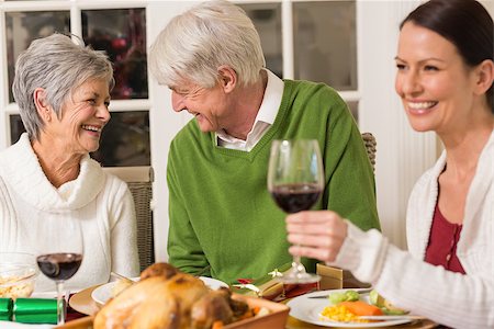simsearch:400-07928326,k - Senior couple laughing at christmas dinner at home in the lliving room Photographie de stock - Aubaine LD & Abonnement, Code: 400-07928987