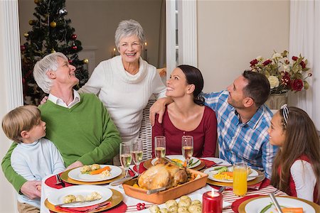 simsearch:400-07929054,k - Happy family posing and looking the grandmother at home in the living room Stock Photo - Budget Royalty-Free & Subscription, Code: 400-07929024