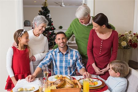 simsearch:400-07929054,k - Happy extended family at christmas time at home in the living room Stock Photo - Budget Royalty-Free & Subscription, Code: 400-07929037
