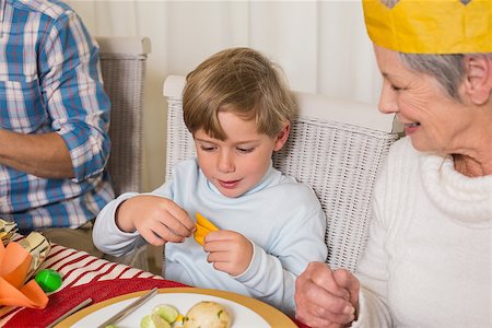simsearch:400-07929054,k - Portrait of grandmother and son in party hat at home in the living room Stock Photo - Budget Royalty-Free & Subscription, Code: 400-07929056
