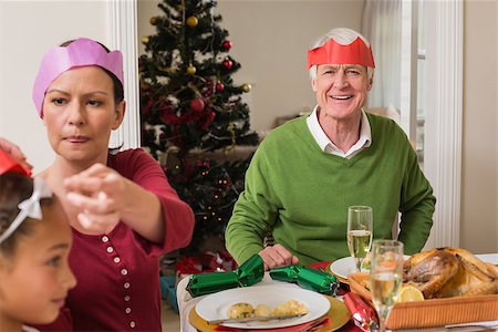 senior woman at christmas parties - Family in party at christmas dinner at home in the living room Stock Photo - Budget Royalty-Free & Subscription, Code: 400-07929053