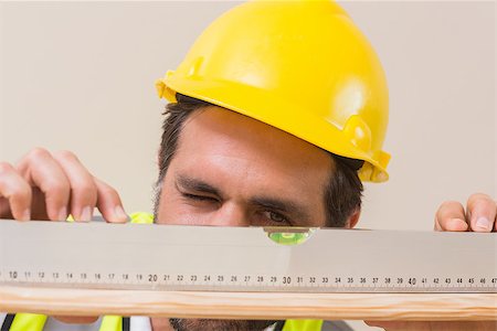 simsearch:400-07929714,k - Construction worker using spirit level in a new house Stock Photo - Budget Royalty-Free & Subscription, Code: 400-07929318