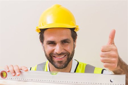 simsearch:400-07929714,k - Construction worker using spirit level in a new house Stock Photo - Budget Royalty-Free & Subscription, Code: 400-07929320