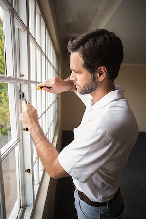 Construction worker fixing the window in a new house Stock Photo - Budget Royalty-Free & Subscription, Code: 400-07929336