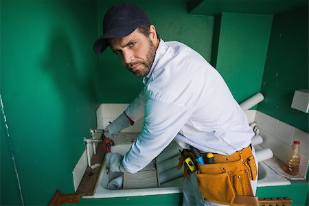 simsearch:400-07929714,k - Construction worker frowning at camera in a new house Stock Photo - Budget Royalty-Free & Subscription, Code: 400-07929343