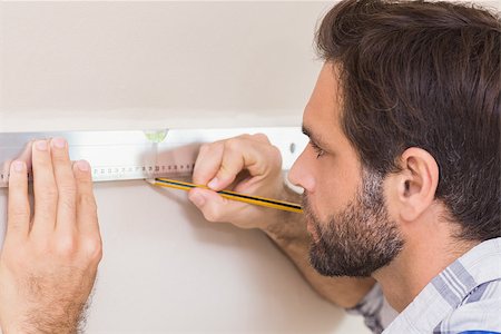 simsearch:400-07929714,k - Construction worker using spirit level in a new house Stock Photo - Budget Royalty-Free & Subscription, Code: 400-07929511