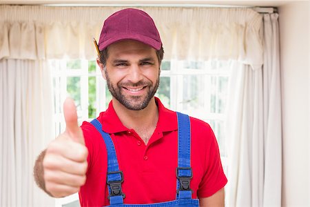 simsearch:400-07929840,k - Construction worker showing thumbs up in a new house Foto de stock - Super Valor sin royalties y Suscripción, Código: 400-07929530