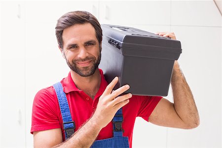 simsearch:400-07929840,k - Construction worker holding tool box in a new house Foto de stock - Super Valor sin royalties y Suscripción, Código: 400-07929533