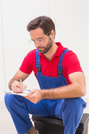 simsearch:400-07929714,k - Construction worker taking notes on clipboard in a new house Stock Photo - Budget Royalty-Free & Subscription, Code: 400-07929541