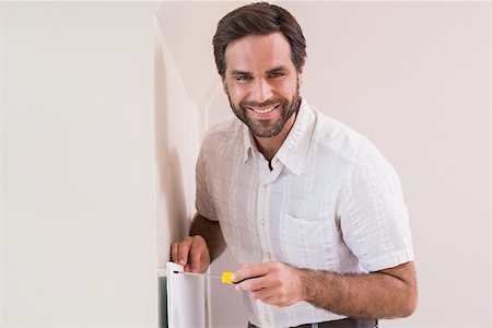 simsearch:400-07929840,k - Handyman hanging up a radiator in a new house Photographie de stock - Aubaine LD & Abonnement, Code: 400-07929550