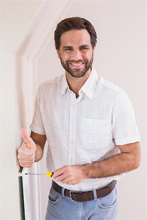 simsearch:400-07929840,k - Handyman hanging up a radiator in a new house Photographie de stock - Aubaine LD & Abonnement, Code: 400-07929551