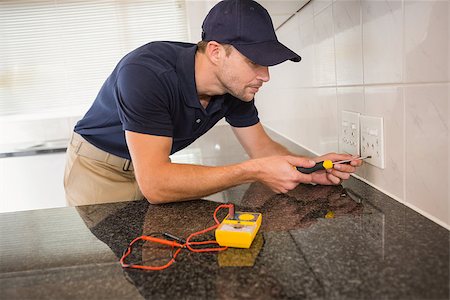 plug in with hand - Electrician unscrewing face plate of plug socket in the kitchen Stock Photo - Budget Royalty-Free & Subscription, Code: 400-07929695