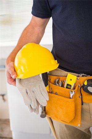 simsearch:400-07929840,k - Close up of man with tool belt in a new house Photographie de stock - Aubaine LD & Abonnement, Code: 400-07929709