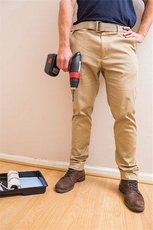 simsearch:400-07929714,k - Construction worker holding power tool in a new house Stock Photo - Budget Royalty-Free & Subscription, Code: 400-07929718