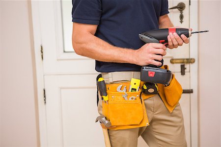 simsearch:400-07929714,k - Construction worker drilling hole in wall in a new house Stock Photo - Budget Royalty-Free & Subscription, Code: 400-07929712