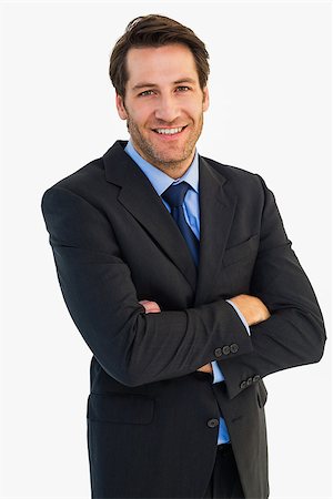 simsearch:400-07274414,k - Smiling businessman with arms crossed on white background Photographie de stock - Aubaine LD & Abonnement, Code: 400-07929869