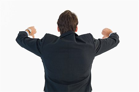 simsearch:400-04861869,k - Rear view of businessman gesturing thumbs down on white background Foto de stock - Royalty-Free Super Valor e Assinatura, Número: 400-07929886