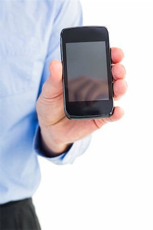 simsearch:400-07664375,k - Businessman showing his smartphone to camera on white background Foto de stock - Royalty-Free Super Valor e Assinatura, Número: 400-07929935
