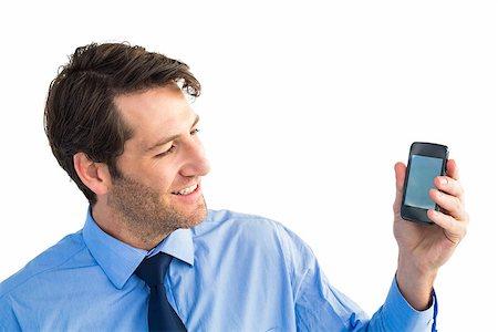 simsearch:400-07139155,k - Smiling businessman showing smartphone to camera on white background Stock Photo - Budget Royalty-Free & Subscription, Code: 400-07929936
