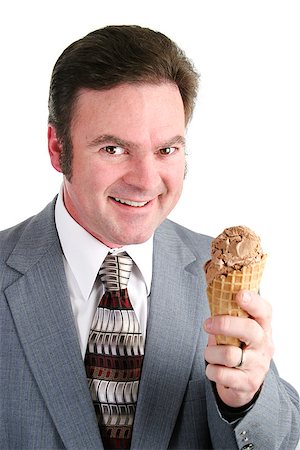 simsearch:400-07920877,k - Handsome businessman excited about eating chocolate ice cream from a waffle cone.  Isolated on white background. Stock Photo - Budget Royalty-Free & Subscription, Code: 400-07920879