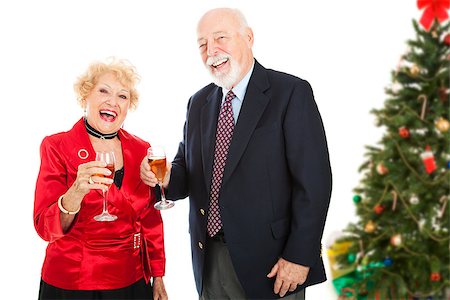 simsearch:400-05234340,k - Senior couple laughing and drinking champagne at a Christmas party.  Isolated on white. Stock Photo - Budget Royalty-Free & Subscription, Code: 400-07920873